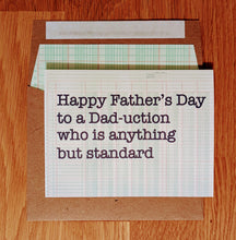 Load image into Gallery viewer, Accounting-themed greeting card atop a ledger-paper lined envelope.  The card says "Happy Father's Day to a Dad-uction who is anything but standard".