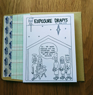 Accounting greeting card with three wise men bringing gifts to baby Jesus and mentioning that they assume he is set up as a 501c3, atop a ledger paper-lined envelope.