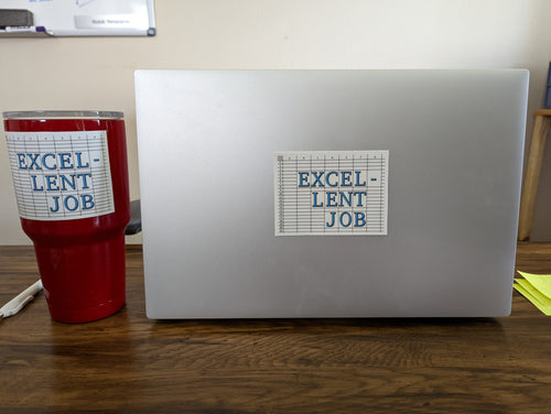 Picture of a desk with a yeti cup and laptop. the cup and laptop each have a sticker that says 