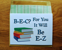 Load image into Gallery viewer, Accounting greeting card, with images of four stacked books titled &quot;Sarbanes Oxley Act of 2002&quot;, &quot;COSO Framework&quot;, &quot;Management Information Systems&quot;, and &quot;Corporate Governance&quot;, with text that reads &quot;B-E-C? For You It Will Be E-Z&quot;, atop an envelope lined in ledger paper
